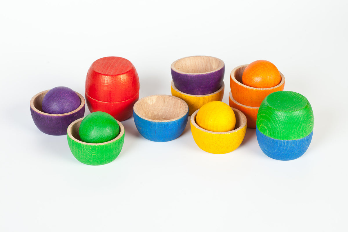 Colourful children's wooden toy bowls and wooden toy balls