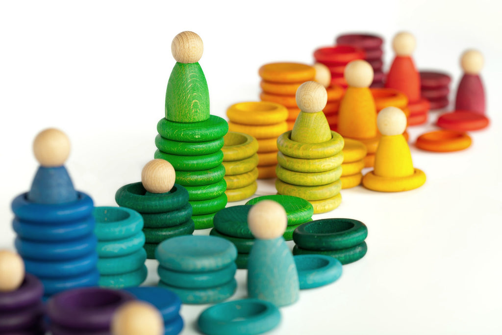Rainbow coloured wooden toy peg people, rings and discs 
