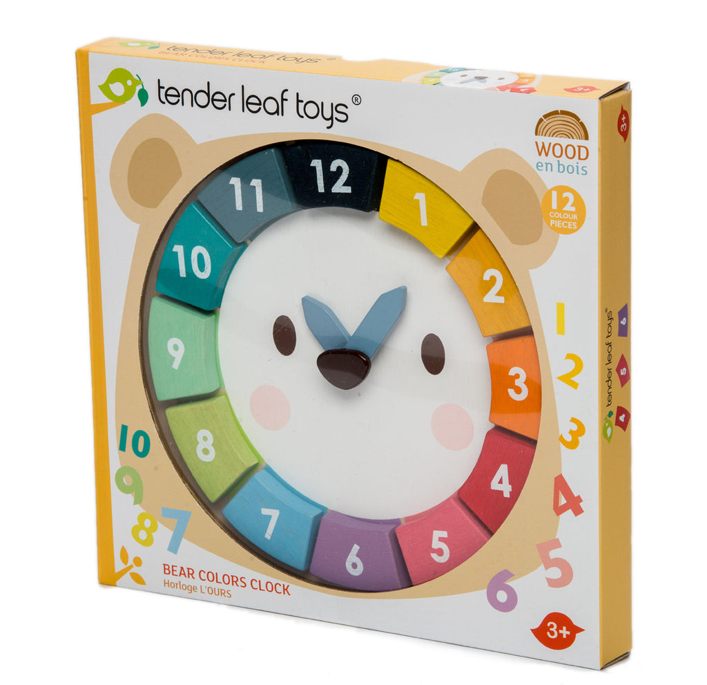 Side view of box containing wooden bear clock with removable numbers and moving hands.